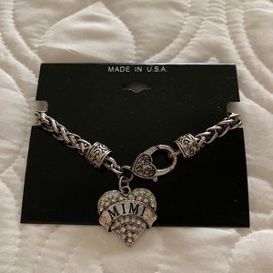 Silver tone bracelet with a Mimi Charm size 8”